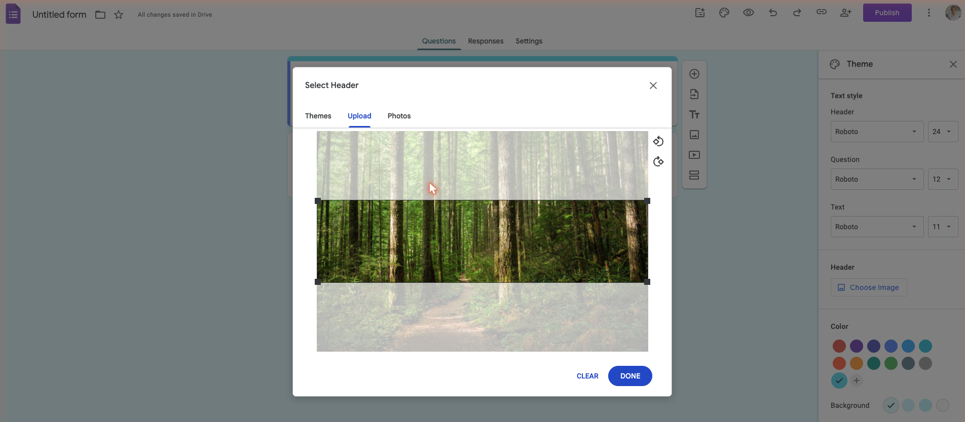 A custom image being cropped in the Google Forms header editor, showing significant portions cut off